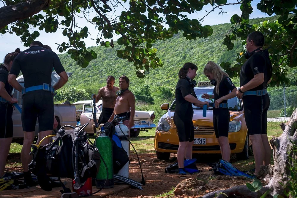 “Scuba diving course group learning equipment setup”
