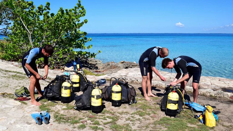 Family preparing for scuba diving experience in Varadero Cuba with instructor