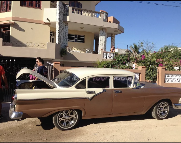 Private transfer vehicle traveling across Cuba