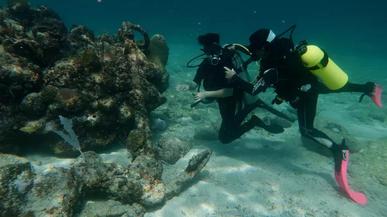 Beginner scuba diver training with instructor in Cuba